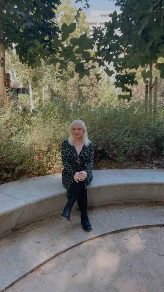 Laura Brodie standing in a green park.