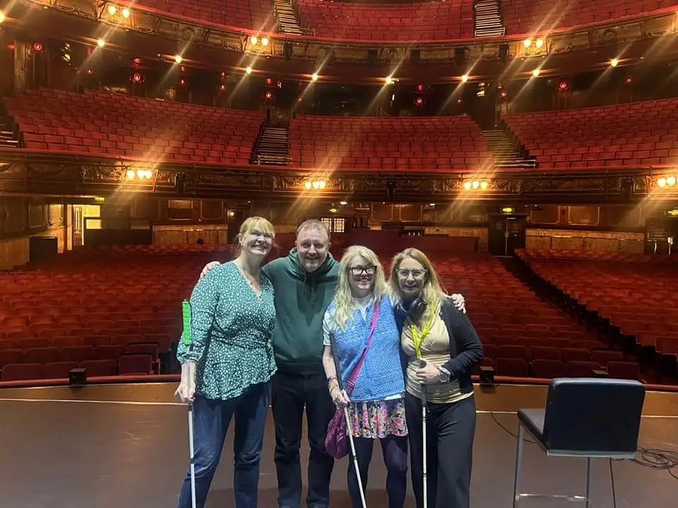 Chris, Suzie, Rachel, and Fiona standing on the stage of the London Palladium just before Chris’s amazing show.